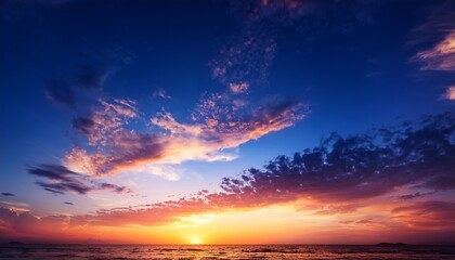 Obraz premium Vibrant Sunset With Twilight Sky And Clouds