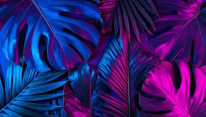 Creative fluorescent color layout made of tropical leaves with neon triangle. Flat lay neon colors. Nature concept.