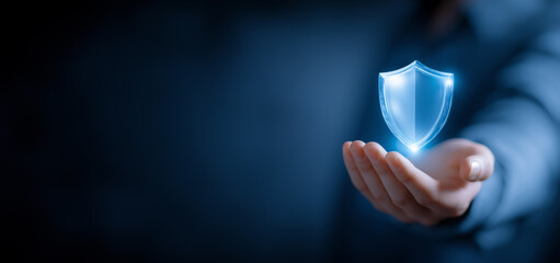 Hand Holding Glowing Shield Icon for Cybersecurity Protection