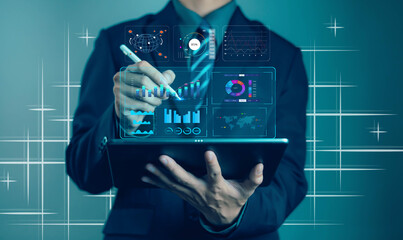 Businessman analyzing financial data on digital tablet with virtual analytics dashboard, futuristic technology concept for data management, finance growth, and digital transformation.