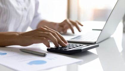 Professional accountant hands using calculator laptop finance report office desk pen analysis budget audit planning with calm focus and precision