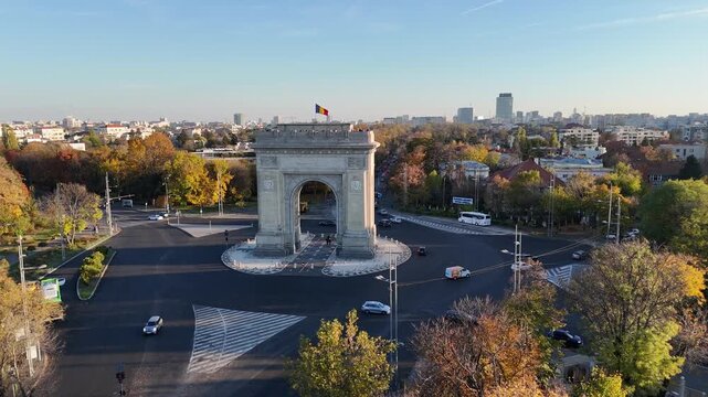 Urban drone image of Arcul de Triumf monument and busy avenue in Bucharest