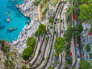 DREAM N°56 – Via Krupp in Capri, winding coastal path with people above turquoise sea