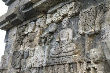 Ancient stone reliefs of Borobudur Temple in sunlight