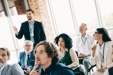 Naklejka premium Diverse Team in a Business Meeting Engaged in Discussion and Collaboration During a Corporate Conference