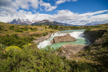 View of the mountain landscape in the national park Torres del Paine, Patagonia, Chile, South America. Paine river and waterfall.