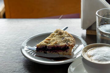 Homemade shortcrust fruit pie with crumble on white background - homemade pastry with fruit or berry (cherry, plum, strawberry, raspberry) jam for tea time