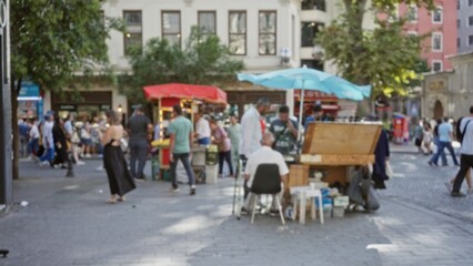 Blurred urban street market scene with defocused vendor stalls, umbrellas and trees, street; background backdrop copyspace template.