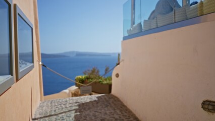 Mediterranean alley with defocused bokeh sea view, warm pastel stucco and pebble walkway overlooking island horizon outdoor; background backdrop copyspace calm.