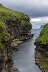 view of the landmark Gjogv Gorge in the middle of Gjogv village on the Faroese Island of Eysturoy