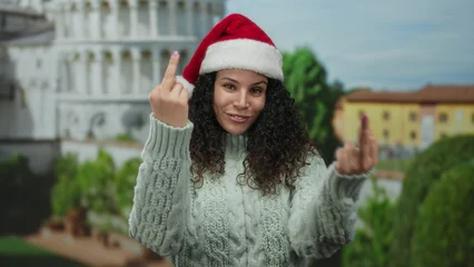 Handdoek met foto De scheve toren Woman in santa hat making rude gesture near pisa tower street outdoor background happy expressive holiday.  © Krakenimages.com