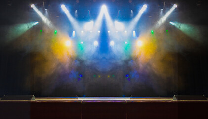 Сoncert on scene theater, stage light with colored spotlights and smoke.