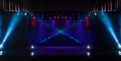 Сoncert on scene theater, stage light with colored spotlights and smoke.