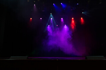 scene, stage light with colored spotlights and smoke