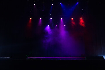 scene, stage light with colored spotlights and smoke