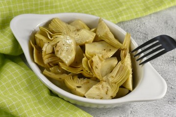 Artichokes in sunflower oil vinegar with garlic. Cynara cardunculus.