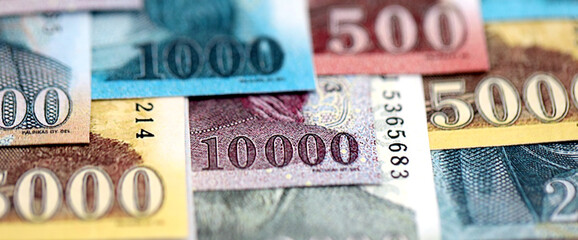 Hungarian Forints currency money bills in big amount. Many HUF currency banknotes with different...