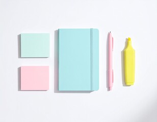 Colorful stationery set featuring a pink notebook, teal stapler, and pen arranged neatly on a clean surface