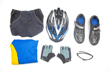Cycling gear laid out on a clean surface for a biking adventure in bright daylight
