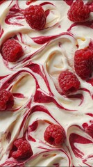 Swirls of creamy dessert blend with vibrant raspberry sauce