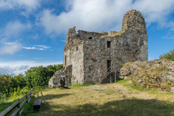 Primda Castle crumbling stone walls under blue sky