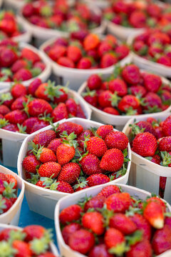 Fresh strawberries selling in baskets at market