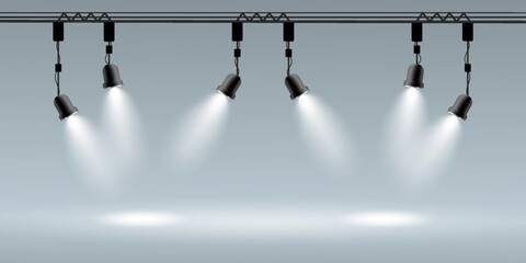 Stage spotlight beams on empty showcase background