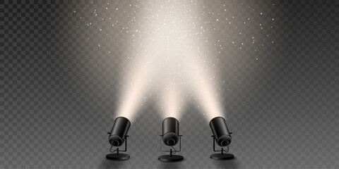 Spotlights shining with light beams and dust particles.