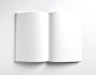 Overhead shot of an open book on a white surface. Both blank pages face upward, displaying a simple and clean aesthetic. Its spine is slightly visible