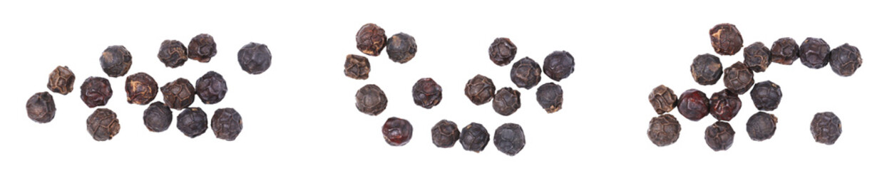 Black peppercorns arranged in groups on white background, dried aromatic spice for cooking and seasoning, organic natural ingredient for culinary recipes, close-up food concept image.