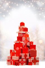 Christmas, New Year gift boxes for holidays promotions. Red and striped wrappers, lush bows.