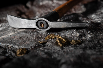 A gold vein, small pieces of gold nuggets within a rock, accumulation of gold in rocks, formed in...