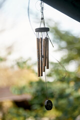 Furin wind chimes with iron tubes and a feng shui symbol