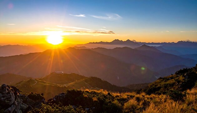 Majestic mountain range silhouette, illuminated by a brilliant sunrise. Golden sunlight bathes the landscape. Distant peaks and open fields - Powered by Adobe