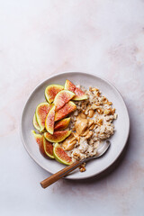 Oatmeal with figs, peanut butter, walnuts and maple syrup.