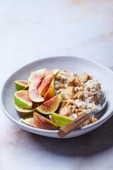 Oatmeal with figs, peanut butter, walnuts and maple syrup.