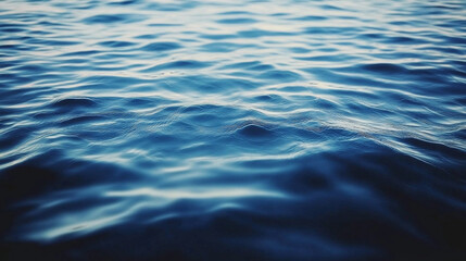 Naklejka premium Gentle ocean waves ripple under soft light, evoking tranquility, serenity, and peaceful connection with nature in a soothing, expansive seascape. 