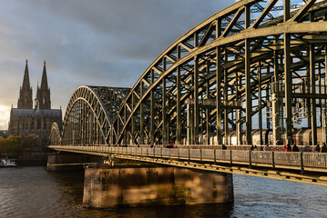 Cologne, Germany - October 26, 2025: Train Crossing Hohenzollern Bridge with Cologne Cathedral in Background