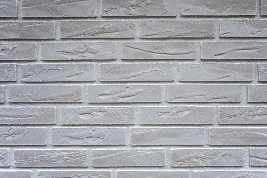 Stone wall with much gray bricks of the modern building. - Powered by Adobe