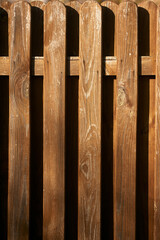 Vertical Slats of Weathered Wooden Fence Background