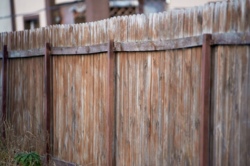 Vertical Slats of Weathered Wooden Fence Background