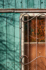 Rustic Window with Stained Glass and Peeling Teal Paint