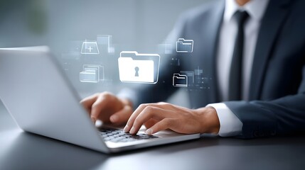 Professional managing digital information and data security via a laptop with illuminated holographic folder icons representing protected files and online privacy
