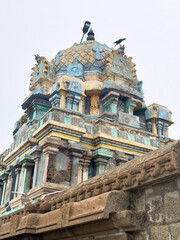 Naklejka premium View of Sri Masilanathar Temple tower near Tharangambadi beach in Tamil Nadu, along the Bay of Bengal's historic Danish colonial shore.