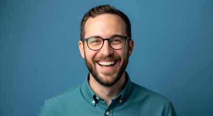 Fototapeta premium Joyful Professional Portrait Smiling Man with Glasses in Studio Happy Employee Authentic Expression Personable Character Optimistic Vision Confidence Success