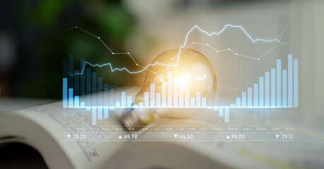 A captivating image that combines a light bulb symbolizing innovation with financial graphs,...