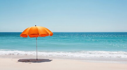Orange beach umbrella on a sandy shore
