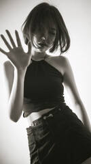 Stylish monochrome portrait of confident woman in fashionable pose
