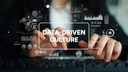 Hands Typing on Keyboard with Overlaid Data-Driven Culture Graphics and Infographics for Business Analysis and Technology Themes. Asymptotic smart data analytic.