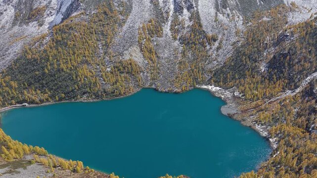 Aerial Drone Footage of Jiayilacuo Lake in Dangling, Sichuan, China Blue Alpine Lake with Autumn Forest